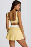 Soft Active Crossover Pleated Mini Skort in Lemon